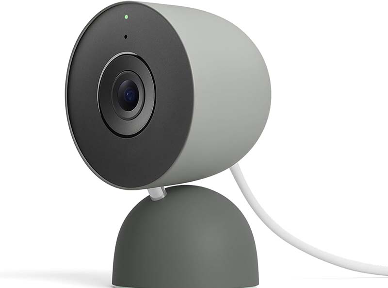 Google Nest Cam Indoor Wired 3rd Gen in white on a shelf