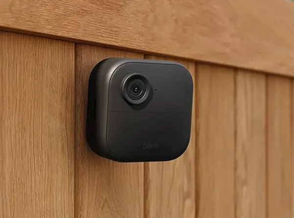 Blink Outdoor 4 wire-free 3-camera security system in black on white background